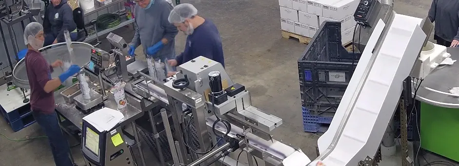 Photo of people working on manufacturing line